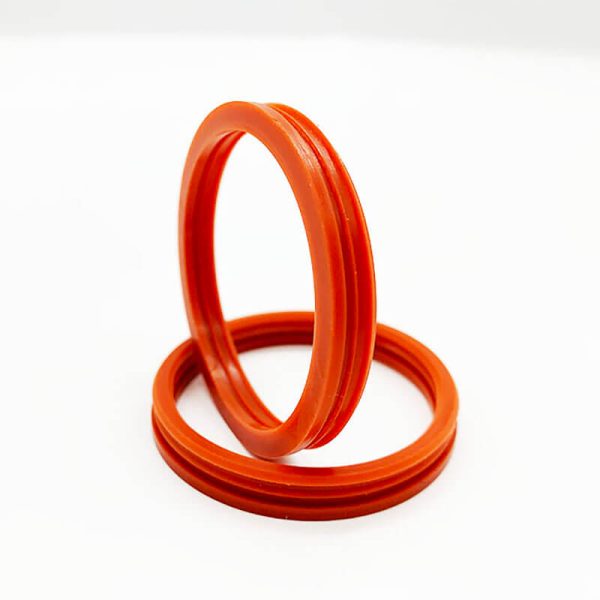 Close-up of Tenchy's orange molded silicone seal rings