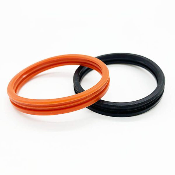 Small orange and black molded silicone seal rings produced by Tenchy