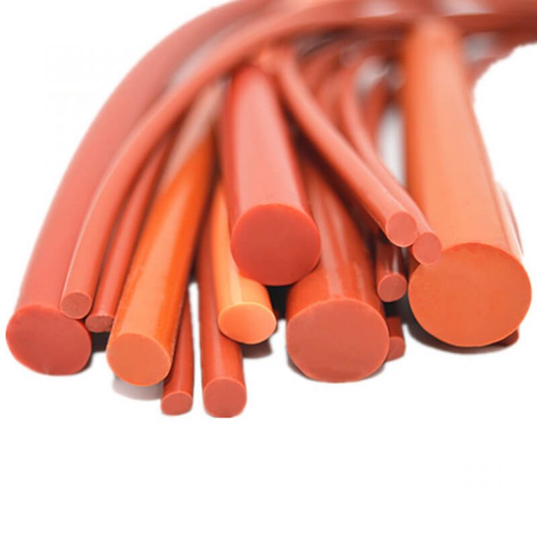 A close-up shot of a pile of Tenchy extruded silicone cords in various sizes. The cords are red and have a smooth, round cross-section